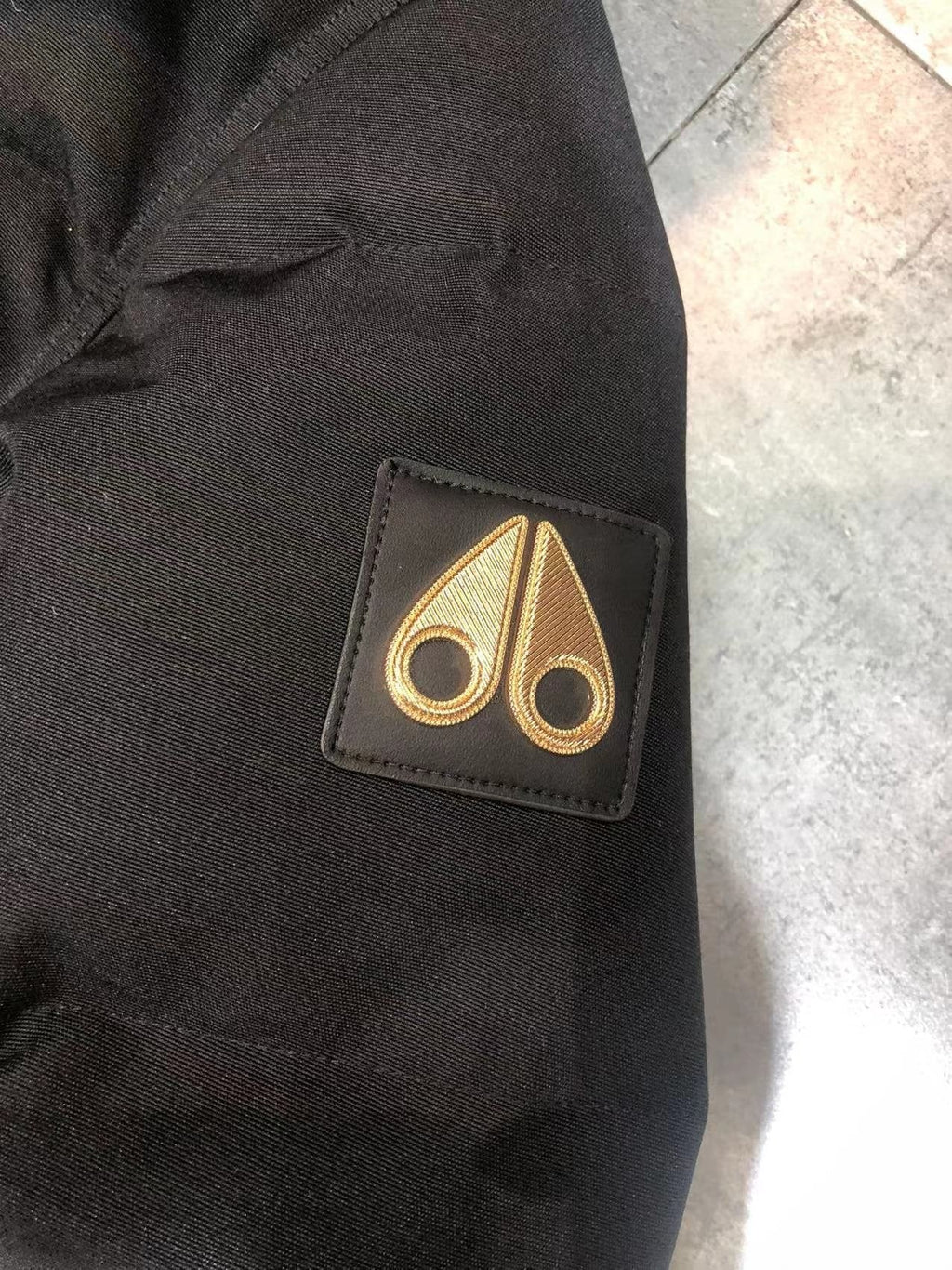 Moose Knuckles Black Hooded Puffer Jacket with Gold Lining