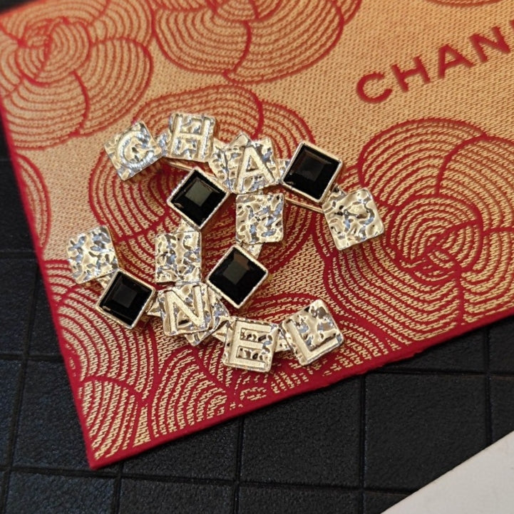 18K Chanel Black Crystals Brooch Yellow Gold-Colour Hardware