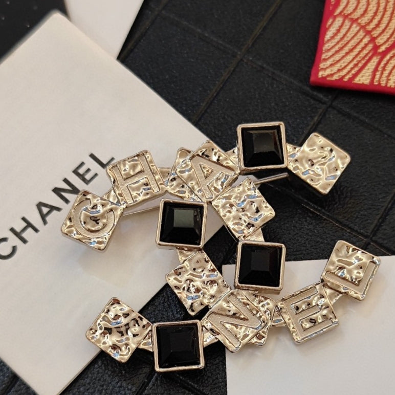 18K Chanel Black Crystals Brooch Yellow Gold-Colour Hardware